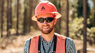 Image of an employee wearing an orange Weyerhaeuser-branded hardhat.
